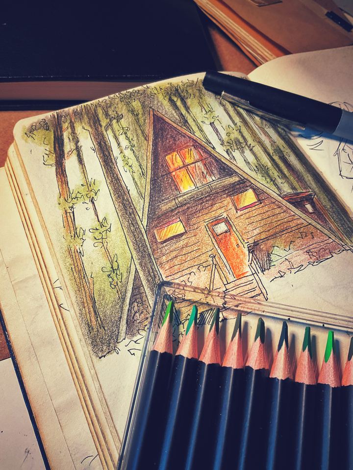 Sketchbook and coloured pencils